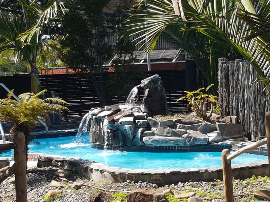 Auckland: Sunset Tour with Thermal pool & Wine Tasting - From Auckland CBD to the West Coast