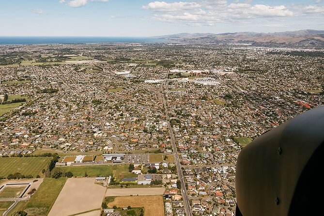 Christchurch City Scenic flight - Pegasus Bay stretching toward Kaikoura