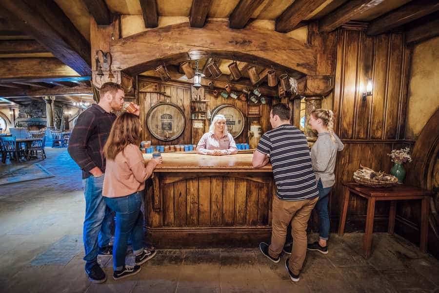From Matamata: Guided Hobbiton Experience with Bus Transfers - The Mill, pond, and paths through the village