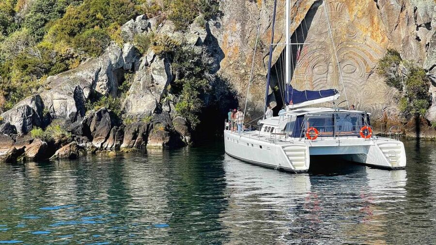 Lake Taupo: Luxury Sailing Catamaran to Māori Rock Carvings - A cold swim in a sheltered bay
