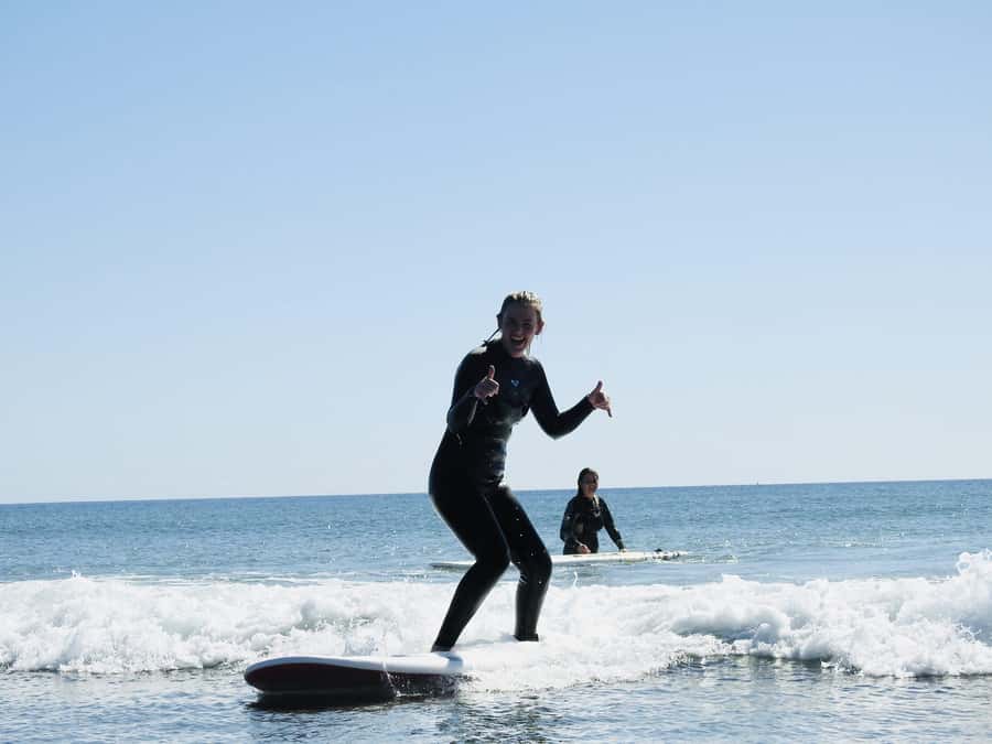 Mount Maunganui: Group Beginner Surf Lesson - Getting fitted with the free wetsuit and board