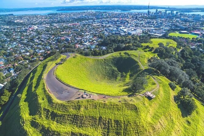 Private FullDay Auckland Sightseeing Tour with Optional PihaBeach - Mount Eden: Auckland’s volcanic viewpoint