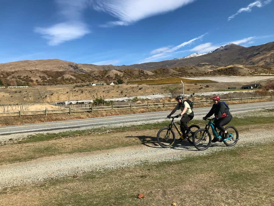 Queenstown: Guided E-Bike Tour with Winery Visits & Tastings - Crossing the rivers and stopping at Kawarau Bridge