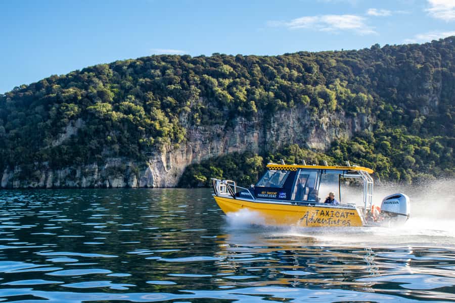 Taupo: Lake Taupo Western Bays Catamaran Tour with Bush Walk - Leaving Kinloch Marina with a burst of speed