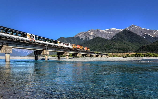 TranzAlpine Train Journey from Greymouth to Christchurch - From Greymouth’s station into West Coast beech forest
