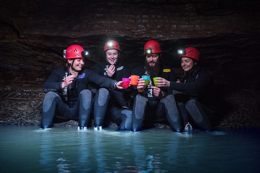 Waitomo Caves Black Abyss Ultimate Caving Experience - Black-water rafting through the cave